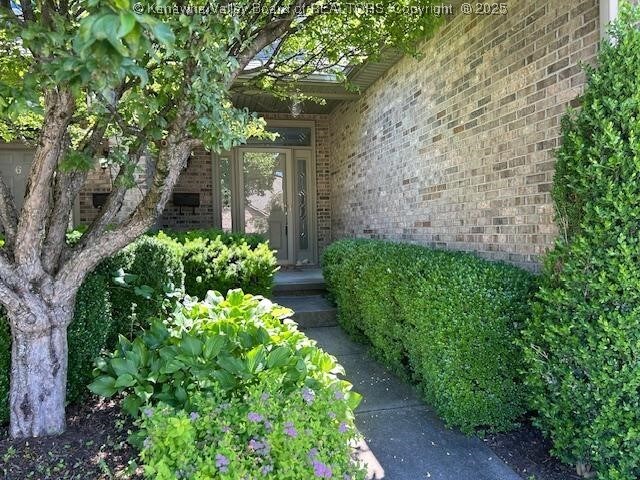 8 Dapplewood Rd, South Charleston, WV 25309 - doorway to property featuring brick siding