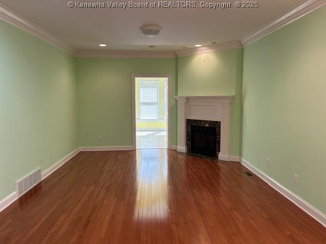 8 Dapplewood Rd, South Charleston, WV 25309 - unfurnished living room with wood finished floors, ornamental molding, baseboards, a premium fireplace, and recessed lighting