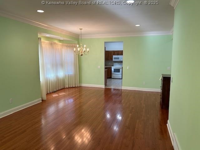 8 Dapplewood Rd, South Charleston, WV 25309 - unfurnished room featuring a chandelier, dark wood finished floors, ornamental molding, baseboards, and recessed lighting