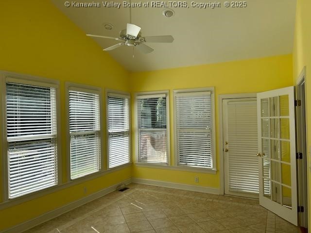 8 Dapplewood Rd, South Charleston, WV 25309 - unfurnished sunroom featuring vaulted ceiling, tile patterned flooring, and baseboards