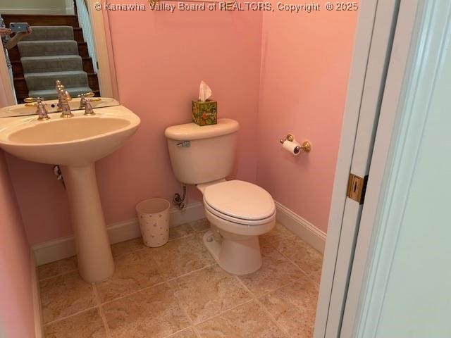 8 Dapplewood Rd, South Charleston, WV 25309 - half bathroom with toilet, tile patterned flooring, and baseboards