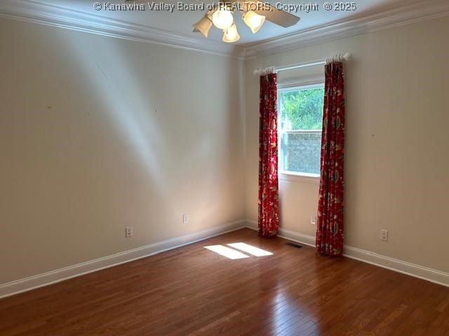 8 Dapplewood Rd, South Charleston, WV 25309 - unfurnished room with crown molding, wood finished floors, baseboards, and ceiling fan