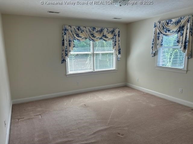 8 Dapplewood Rd, South Charleston, WV 25309 - carpeted empty room featuring baseboards and a textured ceiling