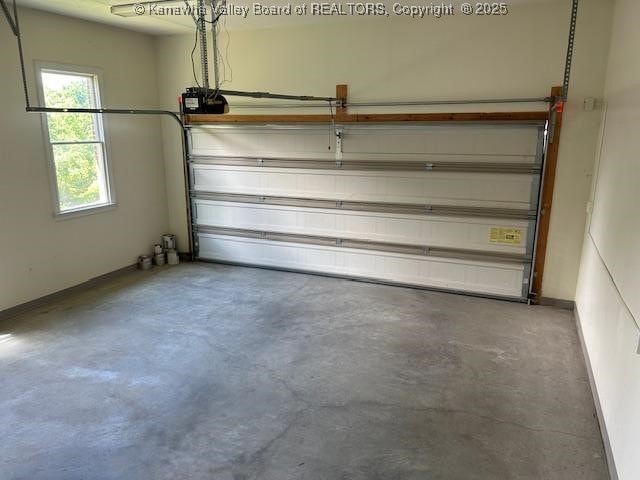8 Dapplewood Rd, South Charleston, WV 25309 - garage featuring baseboards and a garage door opener