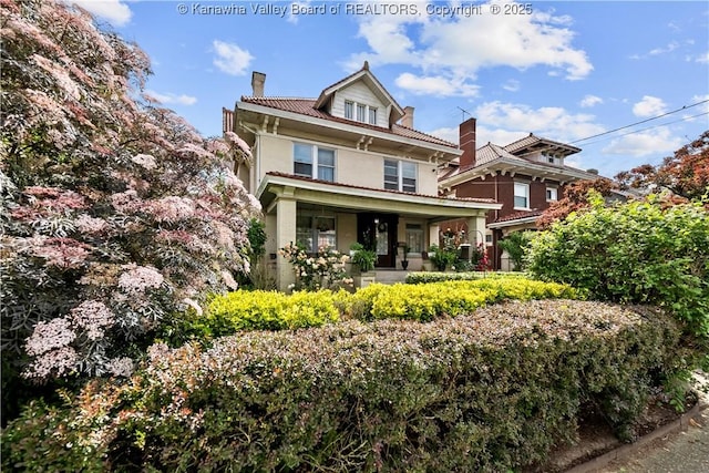 1565 Virginia St E, Charleston, WV 25311 - american foursquare style home with a porch and a chimney