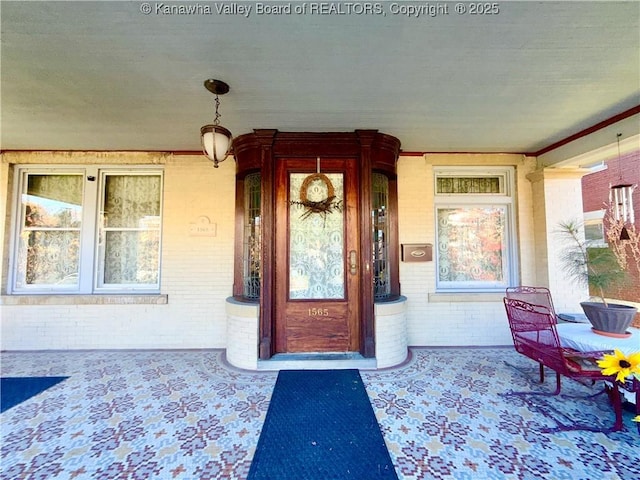 1565 Virginia St E, Charleston, WV 25311 - view of exterior entry featuring brick siding and a porch