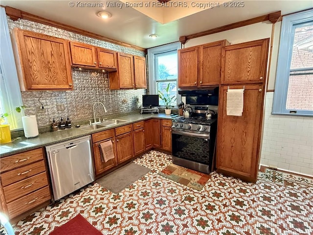 1565 Virginia St E, Charleston, WV 25311 - kitchen with stainless steel appliances, a sink, brown cabinets, light floors, and crown molding