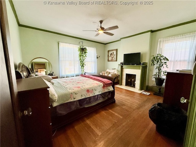 1565 Virginia St E, Charleston, WV 25311 - bedroom with crown molding, wood finished floors, a fireplace with flush hearth, and ceiling fan