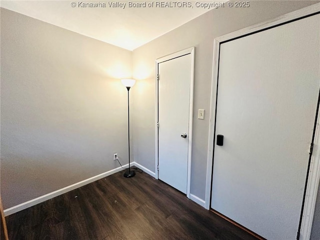 237 Pine Cir, Dunbar, WV 25064 - unfurnished bedroom featuring dark wood-style flooring and baseboards
