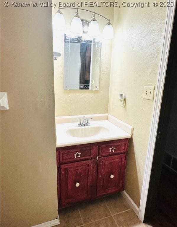 237 Pine Cir, Dunbar, WV 25064 - bathroom with vanity, tile patterned flooring, and baseboards