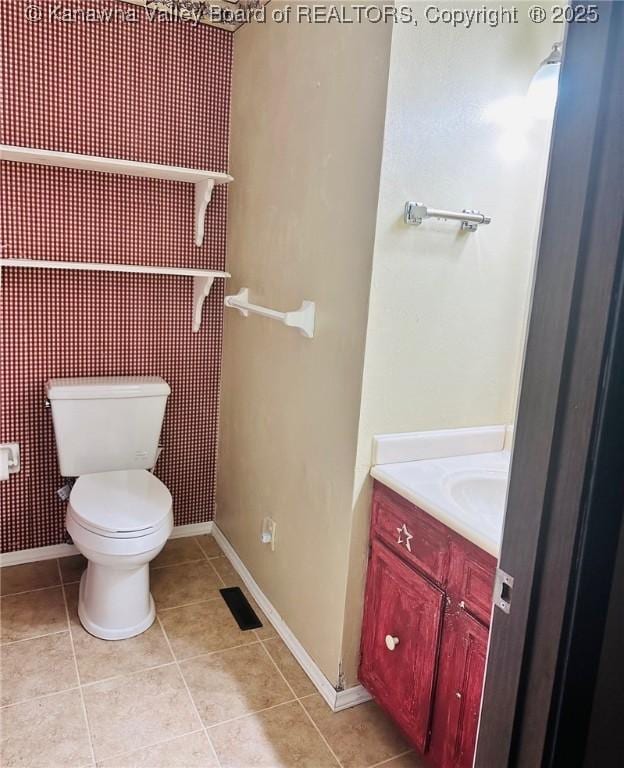 237 Pine Cir, Dunbar, WV 25064 - half bath featuring vanity, toilet, tile patterned flooring, and baseboards