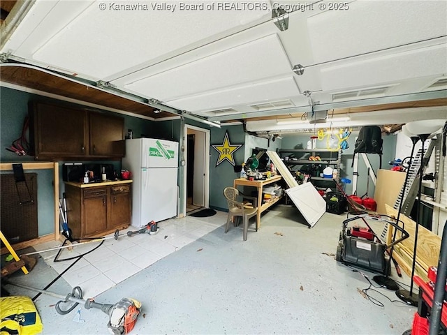 237 Pine Cir, Dunbar, WV 25064 - garage with freestanding refrigerator