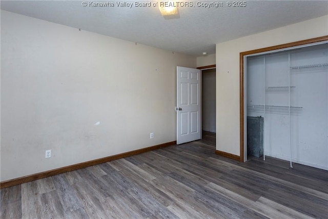 4096 Indian Creek Rd, Elkview, WV 25071 - unfurnished bedroom with wood finished floors, baseboards, and a closet