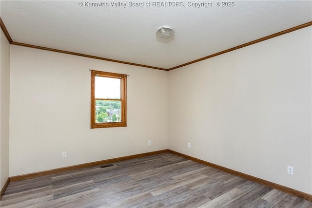 4096 Indian Creek Rd, Elkview, WV 25071 - empty room featuring wood finished floors, crown molding, baseboards, and a textured ceiling