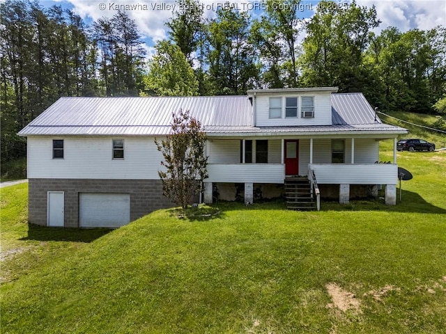 4096 Indian Creek Rd, Elkview, WV 25071 - view of front of house with an attached garage, metal roof, a front yard, and covered porch