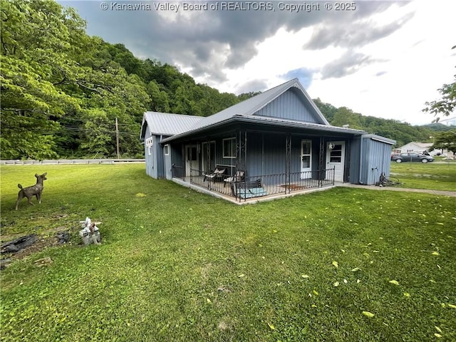 7966 Deepwater Mountain Rd, Kincaid, WV 25119 - rear view of property with a patio area and metal roof