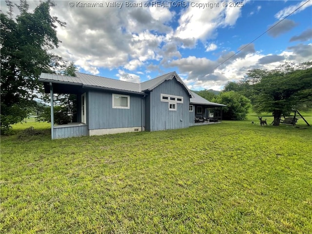 7966 Deepwater Mountain Rd, Kincaid, WV 25119 - rear view of house featuring a lawn and metal roof