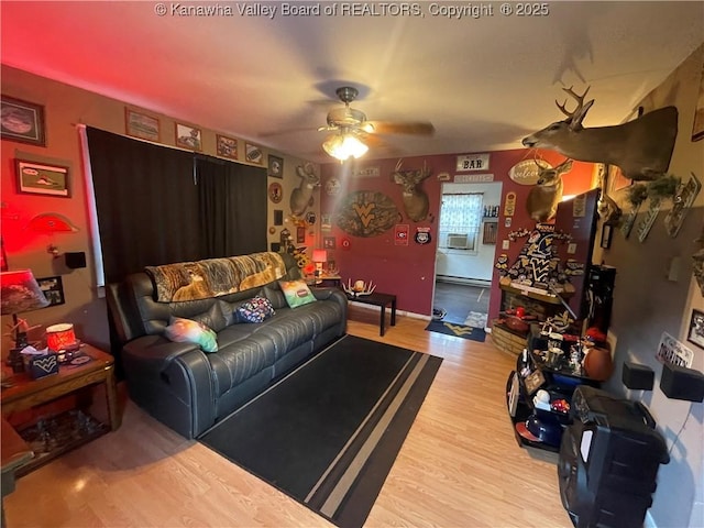 7966 Deepwater Mountain Rd, Kincaid, WV 25119 - living area with a ceiling fan, wood finished floors, and a baseboard radiator