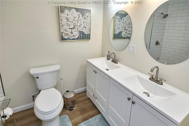 5201 Hammons Dr, Charleston, WV 25313 - bathroom with toilet, wood finished floors, double vanity, and baseboards