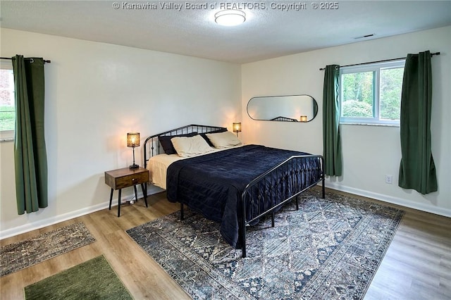 5201 Hammons Dr, Charleston, WV 25313 - bedroom with wood finished floors, baseboards, and a textured ceiling