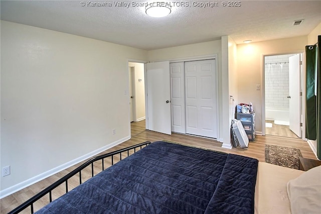 5201 Hammons Dr, Charleston, WV 25313 - bedroom featuring wood finished floors, baseboards, and a textured ceiling