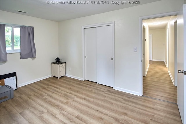 5201 Hammons Dr, Charleston, WV 25313 - unfurnished bedroom featuring light wood-type flooring, baseboards, and a closet