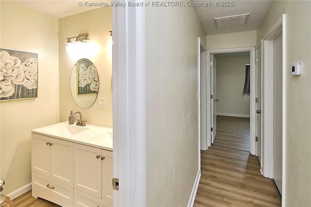 5201 Hammons Dr, Charleston, WV 25313 - hall with a sink, baseboards, and light wood-style flooring