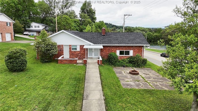5201 Hammons Dr, Charleston, WV 25313 - view of front of property featuring brick siding, a front yard, a chimney, and an outdoor fire pit