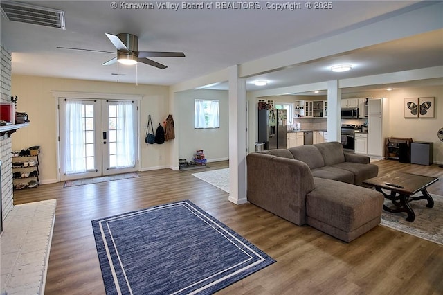 5201 Hammons Dr, Charleston, WV 25313 - living area featuring a ceiling fan, wood finished floors, baseboards, and a fireplace