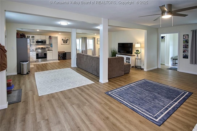 5201 Hammons Dr, Charleston, WV 25313 - living area featuring a ceiling fan, baseboards, and wood finished floors