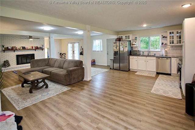 5201 Hammons Dr, Charleston, WV 25313 - living area with light wood-style flooring, a fireplace, baseboards, and recessed lighting