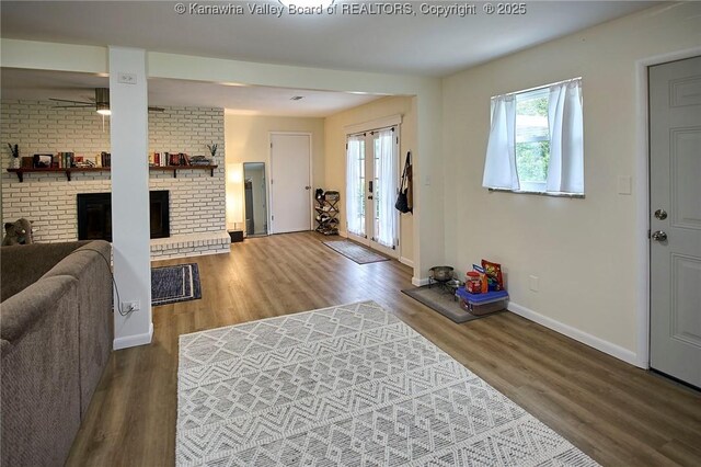 5201 Hammons Dr, Charleston, WV 25313 - living room featuring plenty of natural light, baseboards, and wood finished floors