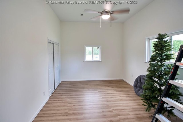 5201 Hammons Dr, Charleston, WV 25313 - spare room featuring healthy amount of natural light, ceiling fan, light wood finished floors, and baseboards