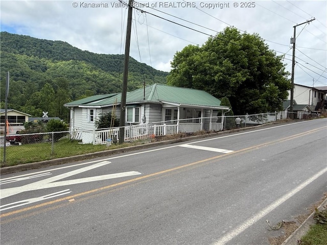 16298 Deepwater Mountain Rd, Wv, WV 25057 - view of front facade featuring a mountain view, a porch, and metal roof