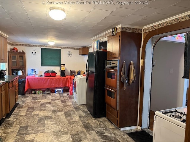16298 Deepwater Mountain Rd, Wv, WV 25057 - kitchen with freestanding refrigerator, double wall oven, washer / clothes dryer, stone finish floors, and white gas range oven