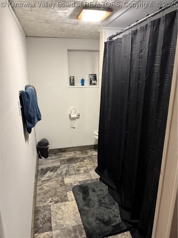 16298 Deepwater Mountain Rd, Wv, WV 25057 - bathroom featuring toilet, a shower with shower curtain, and baseboards
