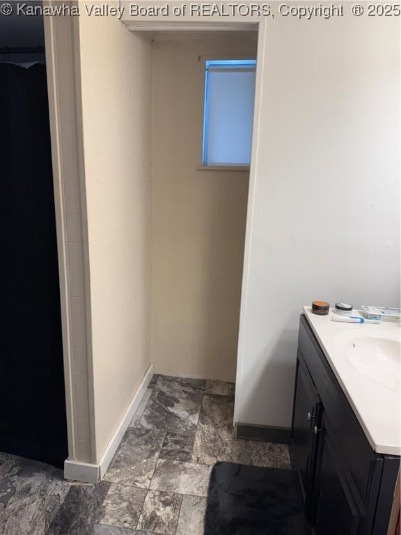 16298 Deepwater Mountain Rd, Wv, WV 25057 - bathroom featuring vanity, baseboards, and stone finish floors
