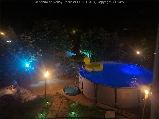 16298 Deepwater Mountain Rd, Wv, WV 25057 - pool at twilight with an outdoor pool and a patio area