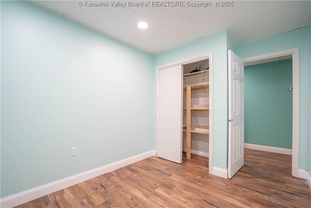102 Utah Hollow Rd, Charleston, WV 25312 - unfurnished bedroom with baseboards, a closet, wood finished floors, and recessed lighting