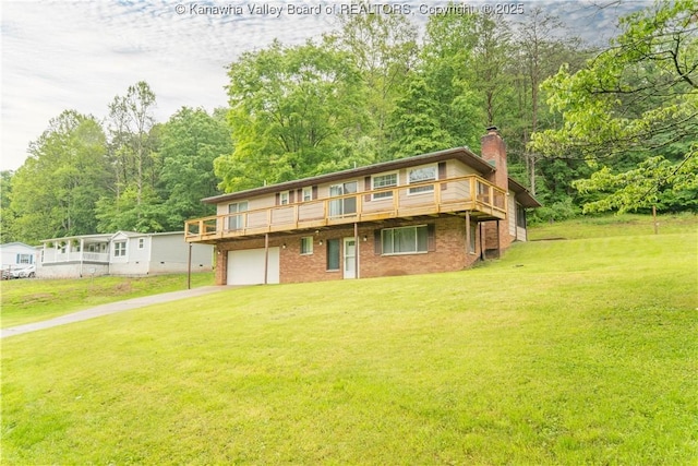 102 Utah Hollow Rd, Charleston, WV 25312 - rear view of property with a yard, driveway, a chimney, and a garage