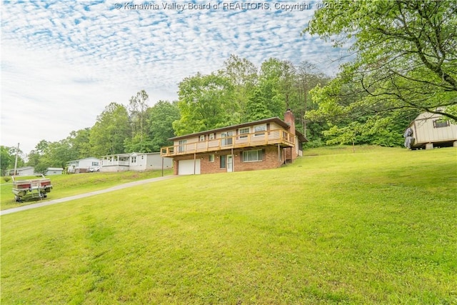 102 Utah Hollow Rd, Charleston, WV 25312 - view of front of property with a front lawn, an attached garage, driveway, and a chimney