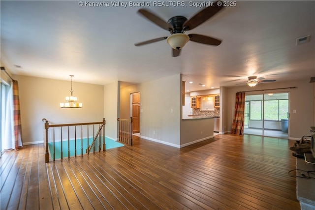 102 Utah Hollow Rd, Charleston, WV 25312 - unfurnished living room with a ceiling fan, a chandelier, hardwood / wood-style floors, baseboards, and recessed lighting