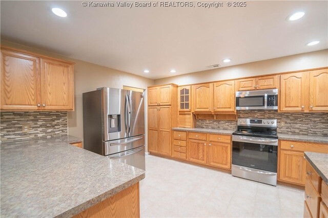 102 Utah Hollow Rd, Charleston, WV 25312 - kitchen featuring stainless steel appliances, tasteful backsplash, recessed lighting, and glass insert cabinets