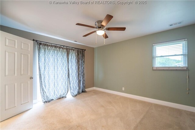 102 Utah Hollow Rd, Charleston, WV 25312 - carpeted spare room with baseboards and a ceiling fan