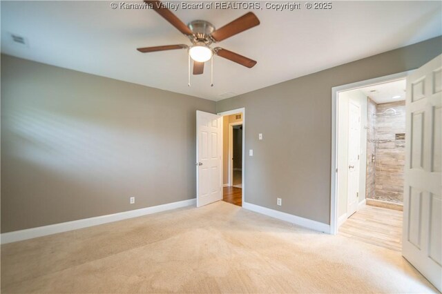 102 Utah Hollow Rd, Charleston, WV 25312 - unfurnished bedroom featuring light colored carpet, baseboards, ensuite bath, and a ceiling fan