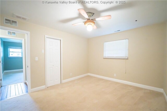 102 Utah Hollow Rd, Charleston, WV 25312 - unfurnished bedroom featuring light colored carpet, baseboards, and a closet