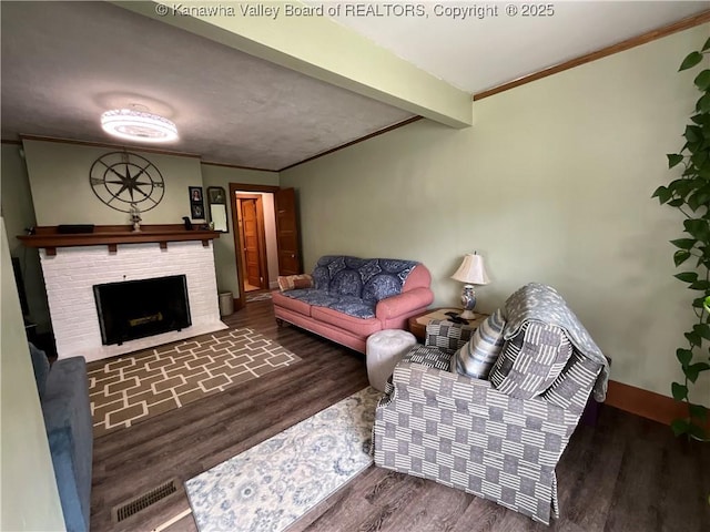 2169 N 21st St, Nitro, WV 25143 - living room with ornamental molding, wood finished floors, a fireplace, baseboards, and beam ceiling