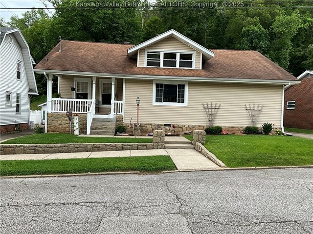 2169 N 21st St, Nitro, WV 25143 - view of front facade featuring covered porch, a front lawn, and roof with shingles