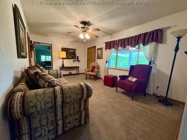 2011 Archibald Dr, Charleston, WV 25320 - carpeted living area featuring a textured ceiling, a ceiling fan, and baseboards