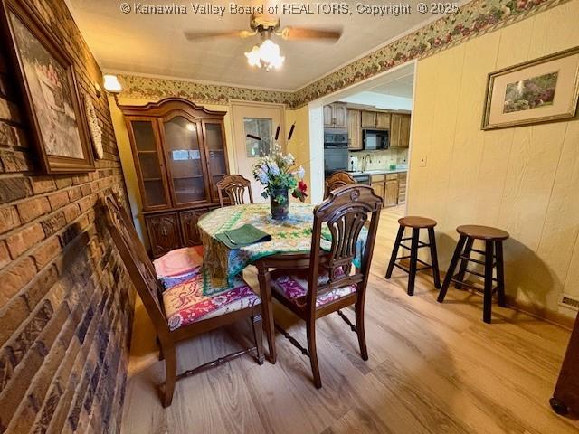 2011 Archibald Dr, Charleston, WV 25320 - dining space featuring light wood finished floors and a ceiling fan